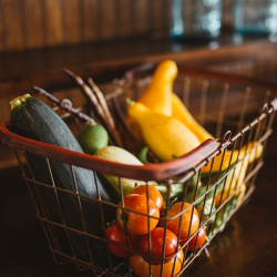 Wire basket filled with vegetebles