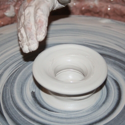 Pottery being thrown on a pottery wheel